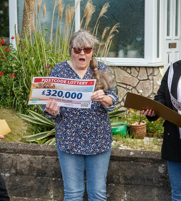 GOBSMACKED: Presenter Matt Johnson revealed their winning cheques