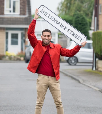 BUMPER NEW YEAR: Postcode Lottery's Danyl Johnson congratulated our winners