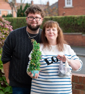 TREE-MENDOUS: Lindsey and Liam with some of her Christmas ornaments