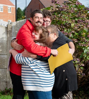 LOVELY CUDDLY: Lindsey and family hug Matt