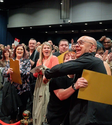 CLINCHED IT: Michelle and Brett hug when they realise she's a big winner