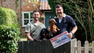 BARKING GLAD: Couple celebrate with dogs Harry and Bertie