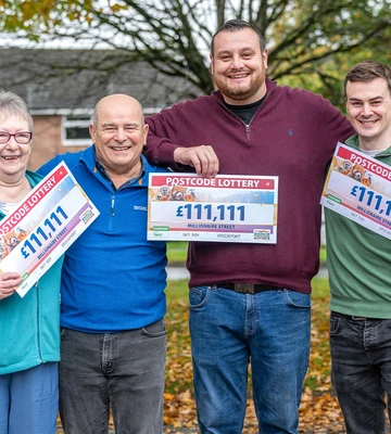 ONES FOR ALL: Gleeful neighbours show off their £111,111 cheques