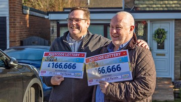 GOLD PALS ACT: Neighbours Bob (left) and David celebrate together