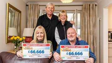 FAMILY FORTUNES: Paul and Kay hold cheques with their siblings Alex and Catherine