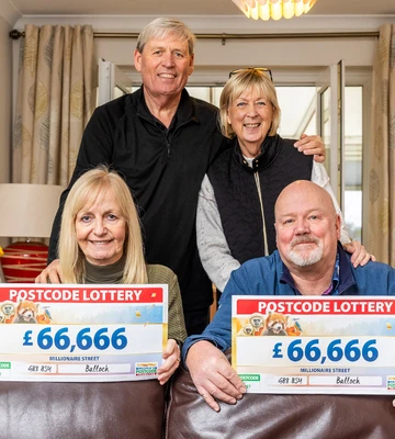FAMILY FORTUNES: Paul and Kay hold cheques with their siblings Alex and Catherine