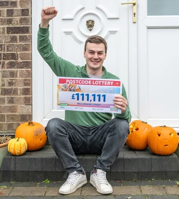 IT'S HALLO-WIN: Lee celebrates prize among his kids' pumpkins