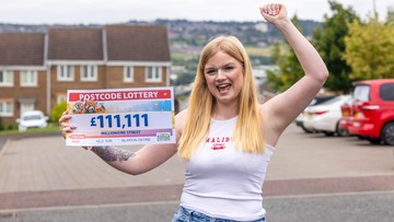 PLEASED AS PUNCH: Christina shows off her winnings