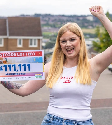PLEASED AS PUNCH: Christina shows off her winnings