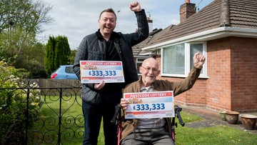 Neighbours Roly and Geoff are all smiles with their cheques