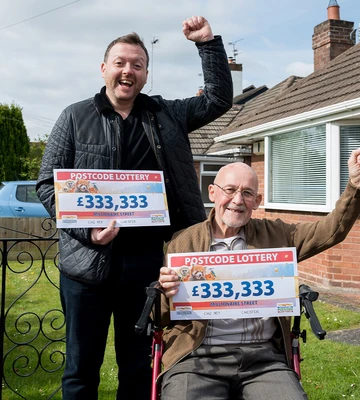 Neighbours Roly and Geoff are all smiles with their cheques