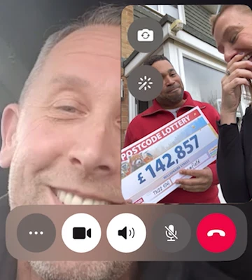 CASH CALL: Lee celebrates from his truck while his wife Sam collects his cheque