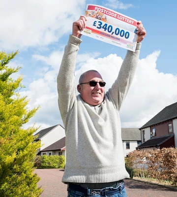 High Roller: Winner Garry holds up prize cheque