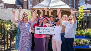 HAPPY PLACE: Charity team welcome Millionaire Street funding
