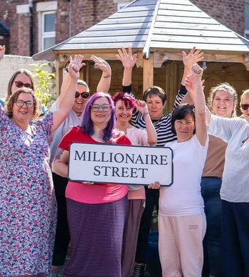 HAPPY PLACE: Charity team welcome Millionaire Street funding